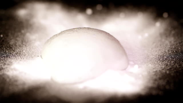 White-powder-on-top-of-the-paper.-Chemical-Reaction-Texture-Of-Bubbling-Powder.-Quenching-soda-vinegar-macro