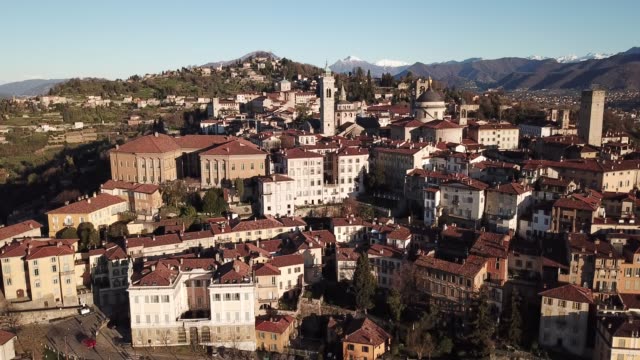 Drone-aerial-view-of-Bergamo---Old-city.-One-of-the-beautiful-town-in-Italy.-Landscape-on-the-city-center-and-its-historical-buildings-during-a-wonderful-blu-day