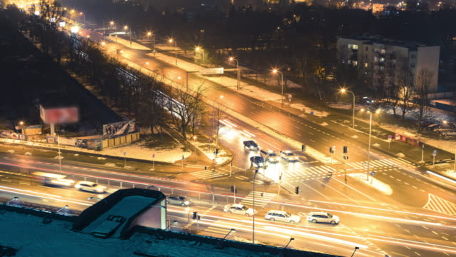 Night-time-lapse-of-busy-crossroad-(close-up)