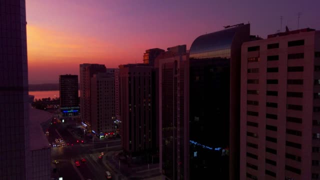 Beautiful-magical-sunset-with-the-moon-in-Abu-Dhabi-city,-United-Arab-Emirates