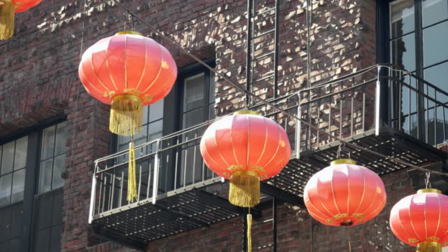 red-lanterns-in-front-of-a-brick-wall-in-Chinatown-of-san-francisco