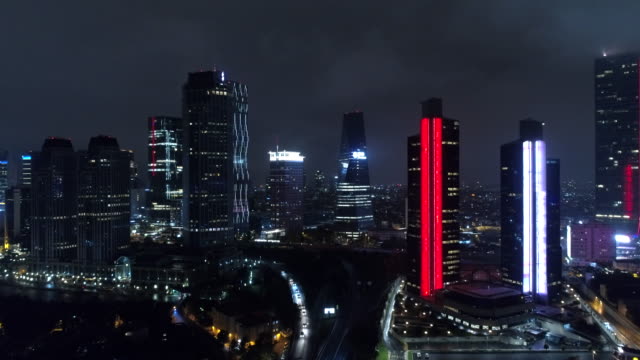 Skyscrapers-in-Istanbul-At-Night-:-Aerial-Drone-view-of-illuminated-Buildings