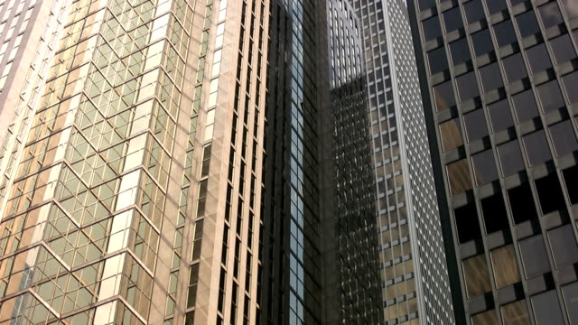 Buildings-reflect-clouds.-Timelapse.