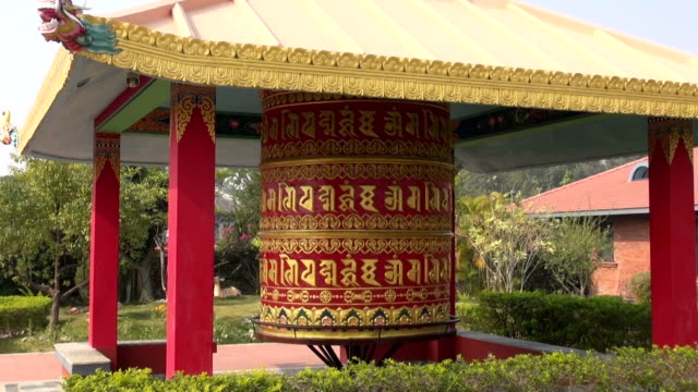 beautiful-buddhist-prayer-wheel-in-Lumbini,-Nepal