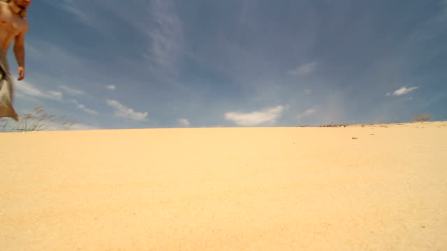 A-man-walks-through-the-desert