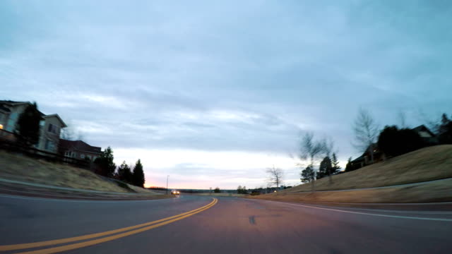 Driving-on-suburban-road-early-in-the-morning.