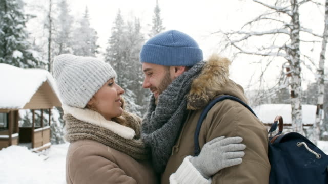 Loving-Couple-Kissing-in-Park-at-Winter-Day