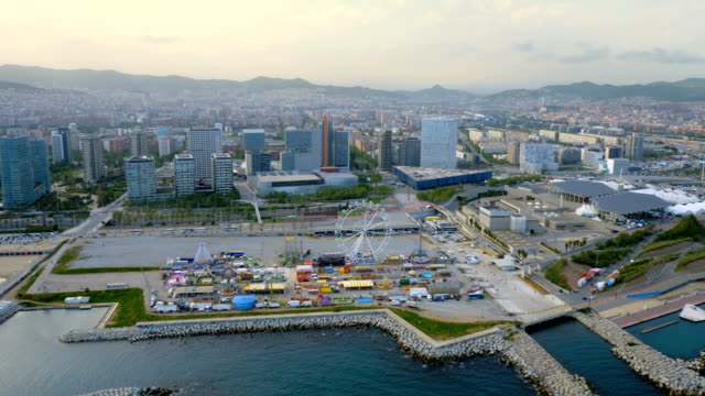 Barcelona-skyline-aerial-view-with-modern-buildings-and-amusement-park-by-the-beach