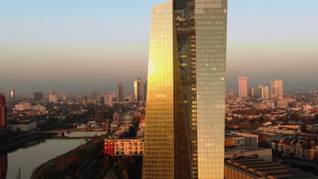 Frankfurt-ECB-Skyline-Aerial-Shot-at-early-sunrise-reflecting-sun