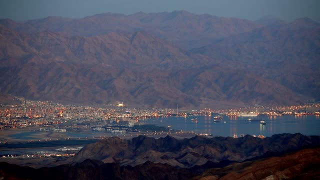 Evening-view-from-Eilat-mountains-to-aqaba-gulf,-Israel.-Panning-shot