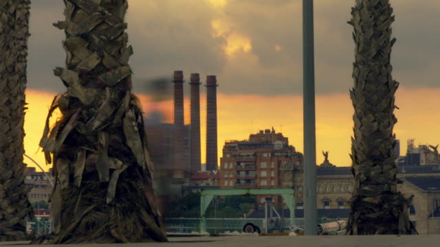 Industrial-area-at-sunset.-Timelapse-of-clouds-over-industrial-buildings