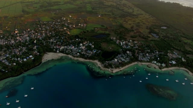 Aerial-view-of-Mauritius-town,-bay-and-farmlands