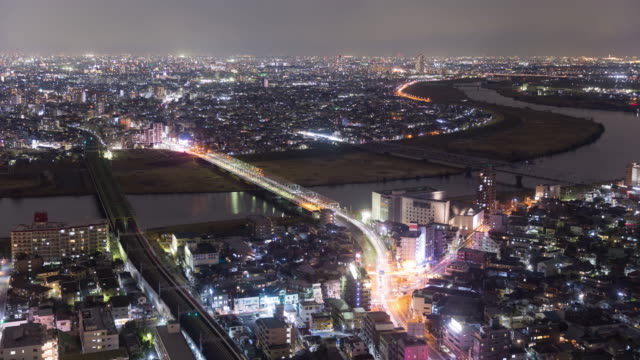 Vista-de-noche-de-la-ciudad-de-Riverside-(Ichikawa-la-ciudad-de-Chiba-y-Edogawa-ku-Tokyo-Japón)