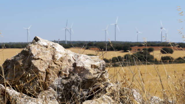 Wind-Turbines-on-a-Background-of-Stone-in-the-Desert-of-Spain