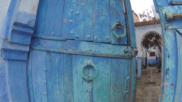 Large-old-wooden-door-located-in-the-town-of-Chefchaouen-in-Morocco