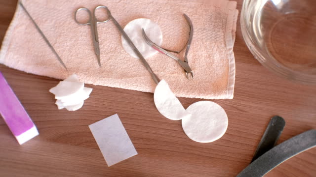 Manicure-tools-on-the-towel-on-table.