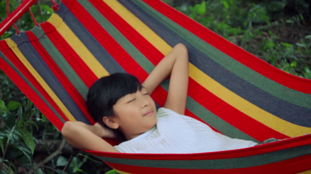 Slow-motion,-Little-girl-is-sleeping-in-hammock