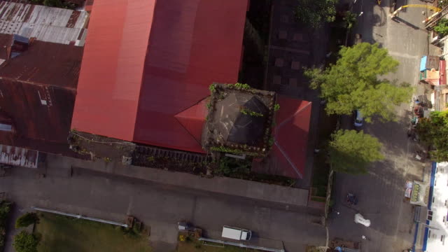 Spanish-architecture-of-16th-Century-Saint-Gregory-the-Great-Parish-Church-Tower-at-the-foot-of-Mt.-Banahaw.-Drone-aerial-shot