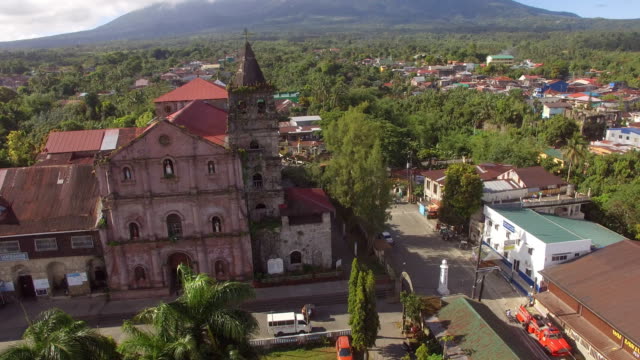 Spanish-architecture-of-16th-Century-Saint-Gregory-the-Great-Parish-Church-Tower-at-the-foot-of-Mt.-Banahaw.-Drone-aerial-shot