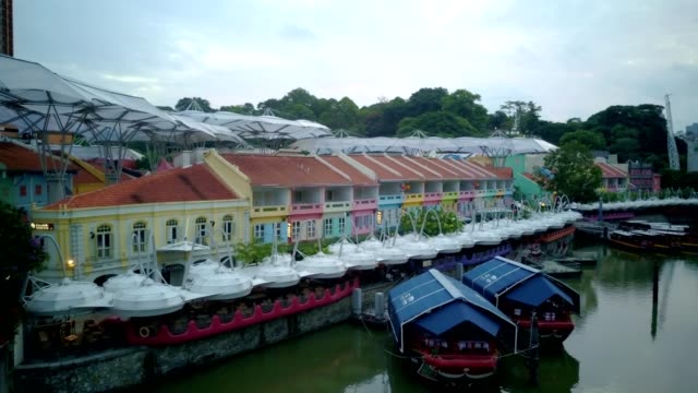 Aerial-video-of-Clarke-Quay-with-city-skyline-at-background