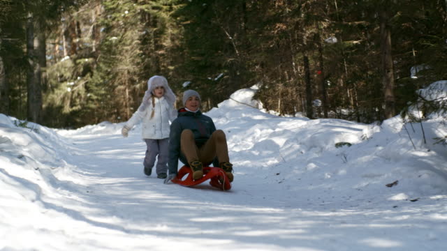 Brother-and-Sister-Playing-in-Winter-Forest