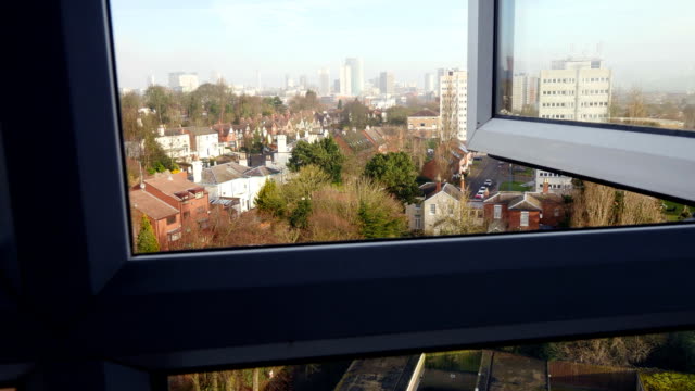 City-view,-camera-tracking-through-a-window.