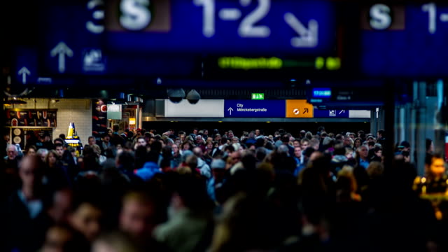 crowed-people-walking-in-illuminated-central-station-timelapse