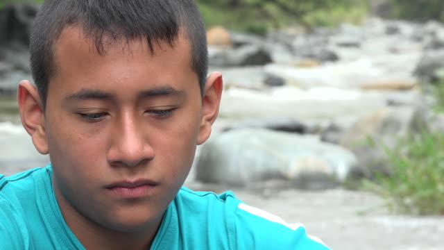 Teenage-Boy-sad-near-River
