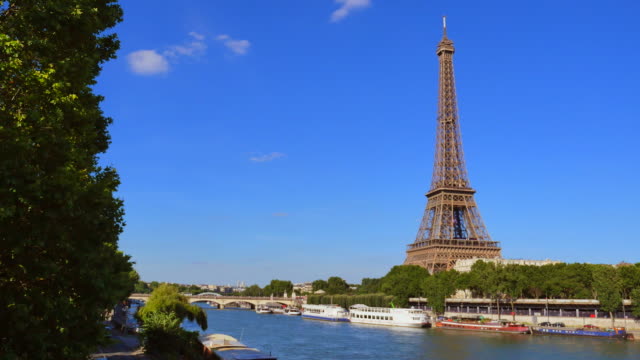 Cruise-Ship-On-Seine-River-By-Buildings-In-City-Against-Clear-Sky
