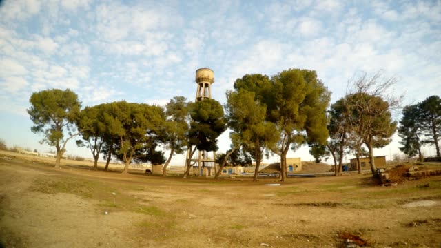 a-small-grove-of-trees-and-a-water-tower,-close-to-the-border-between-Turkey-and-Syria