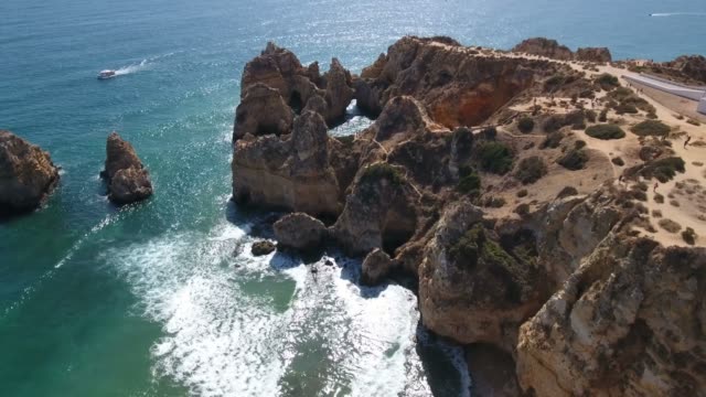 Aerial-view-of-Ponta-da-Piedade-rock-formations-in-Lagos,-Portugal