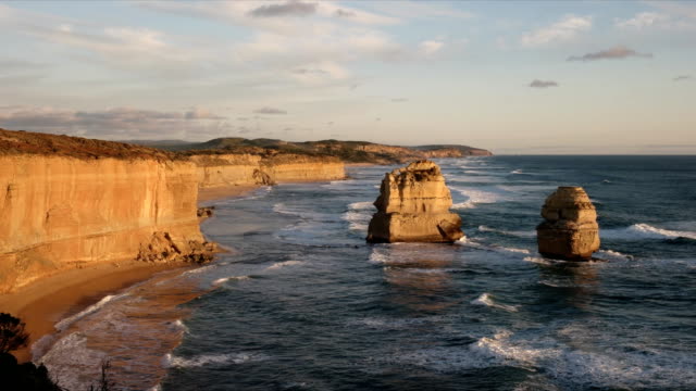 tilt-down-view-of-the-twelve-apostles-at-sunset-looking-east