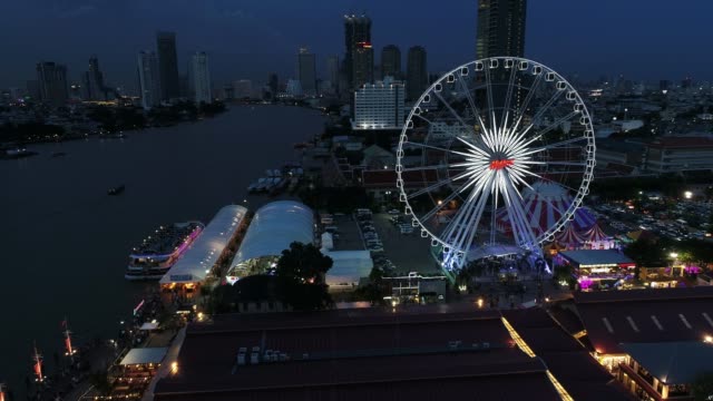 Bangkok,Thailand-:-Aerial-view-from-drone-on-the-Asiatique-The-Riverfront-and-Chao-Phraya-river-at-night-time