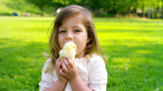 Little-Girl-Playing-with-Chick