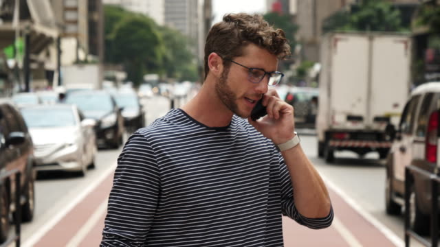 Smiling-guy-takes-call