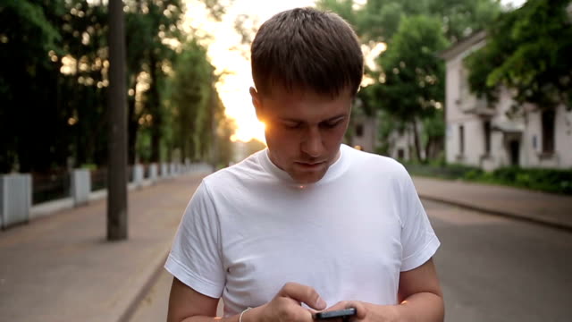 Man-with-smartphone-walking.-Slow-motion
