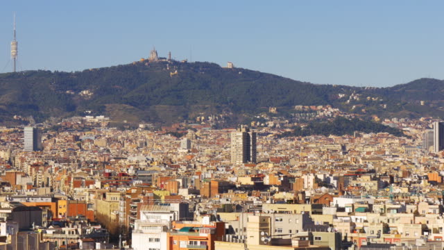 barcelona-sun-light-city-panorama-tibidabo-mountain-view-4k-spain