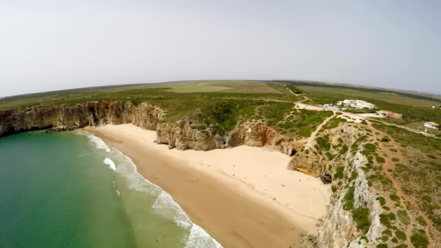 Aerial-video-footage-of-beautiful-bay-and-sandy-beach-of-Praia-do-Beliche-near-Cabo-Sao-Vicente,-Algarve-region,-Portugal