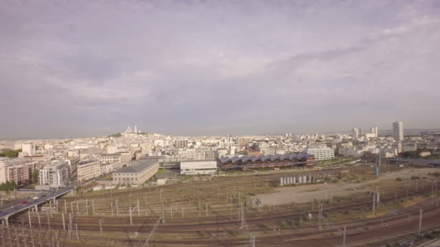 Paris,-10th-arrondissement---Aerial-view-of-Paris-with-Gare-du-nord-railway-in-foreground-and-tilt-up-of-city-skyline