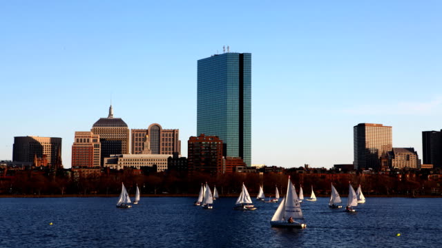 Timelapse-Boston-city-center-with-sailboats-in-front
