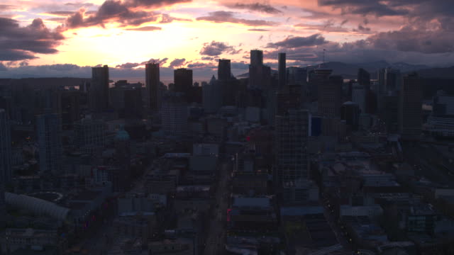 Aerial-View-flying-over-downtown-Vancouver-at-sunset
