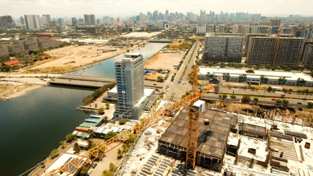 Building-under-construction-with-cranes-in-the-city.-Philippines,-Manila,-Makati