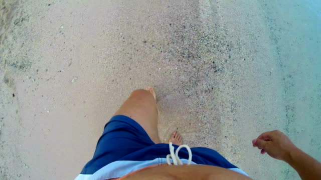 4k-lost-man-walking-on-sand-with--footsteps-in-sand,-POV-from-above