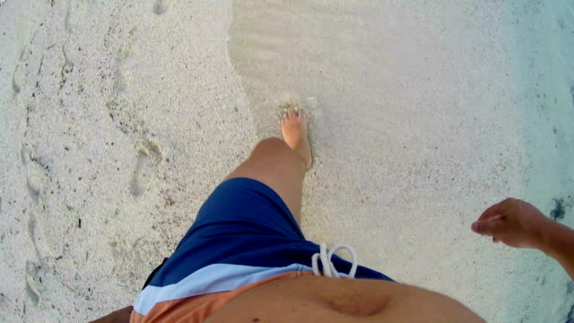 4k-lost-man-walking-on-sand-with--footsteps-in-sand,-POV-from-above