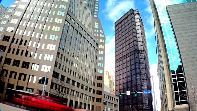 A-time-lapse-shot-of-tall-buildings-at-the-corner-of-5th-and-Ross-Streets-in-downtown-Pittsburgh,-Pennsylvania.