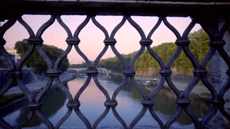 Cityscape-of-Rome,-Italy,-with-river-Tiber,-bridge,-church-dome-and-trees-at-summer-sunset