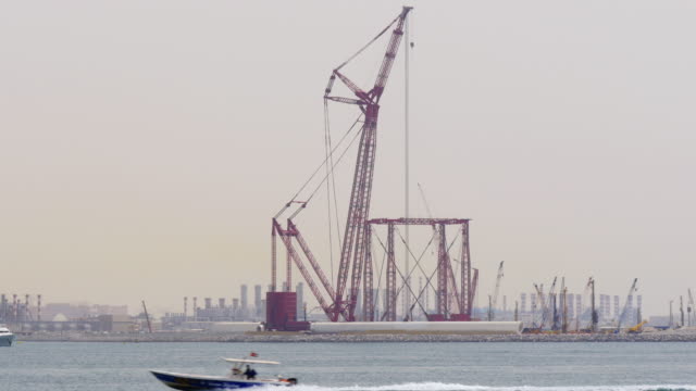 dubai-city-day-time-sea-red-construction-crane-4k-uae