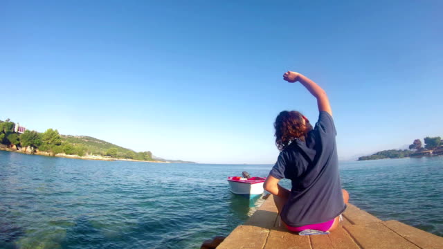 beach-yoga-,-caucasian-girl-on-a-dock-4K