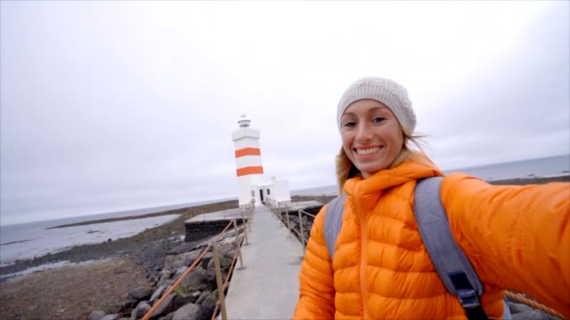Travel-woman-taking-selfie-at-lighthouse-SLOW-MOTION