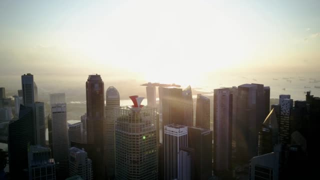 Beautiful-morning-drone-footage-of-Singapore-urban-skyline-at-central-business-district-with-marina-bay-background.